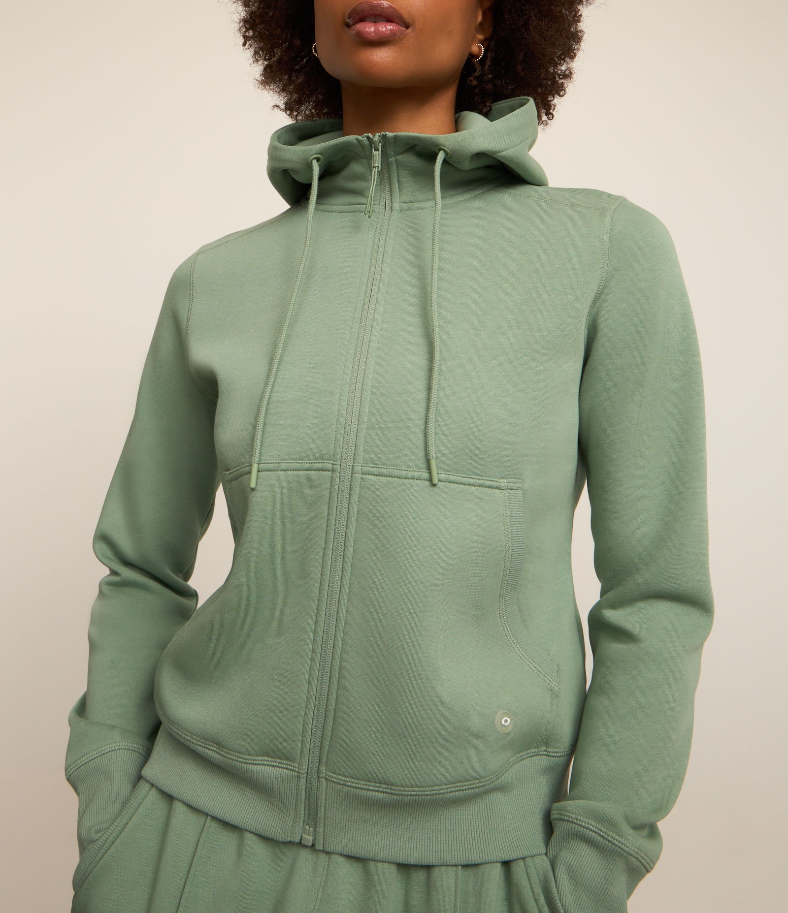 Jaqueta Esportiva em Mix de Tecidos com Capuz e Bolsos Verde 1