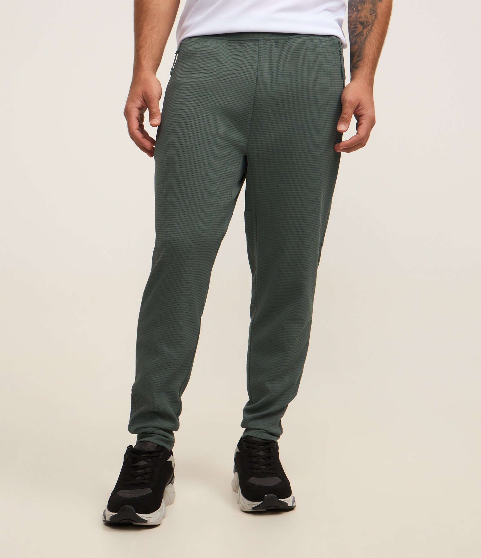 Calça Esportiva em Tecido Texturizado com Zíper nos Bolsos Verde 2