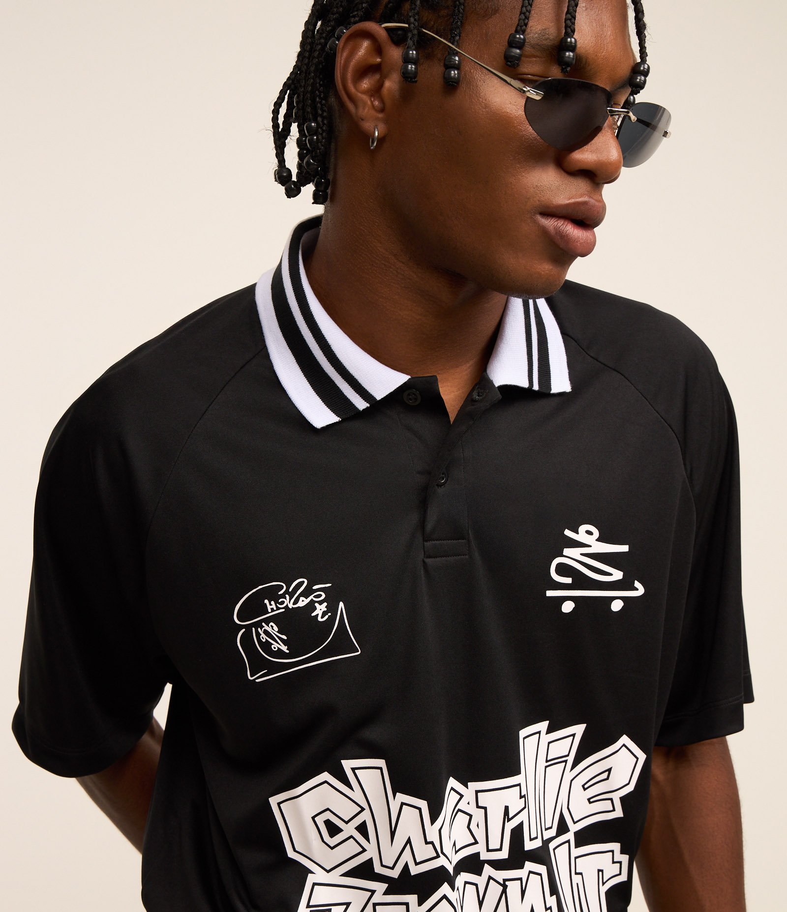 Camisa Polo Boxy com Estampa do Chalie Brown Jr Preto 4