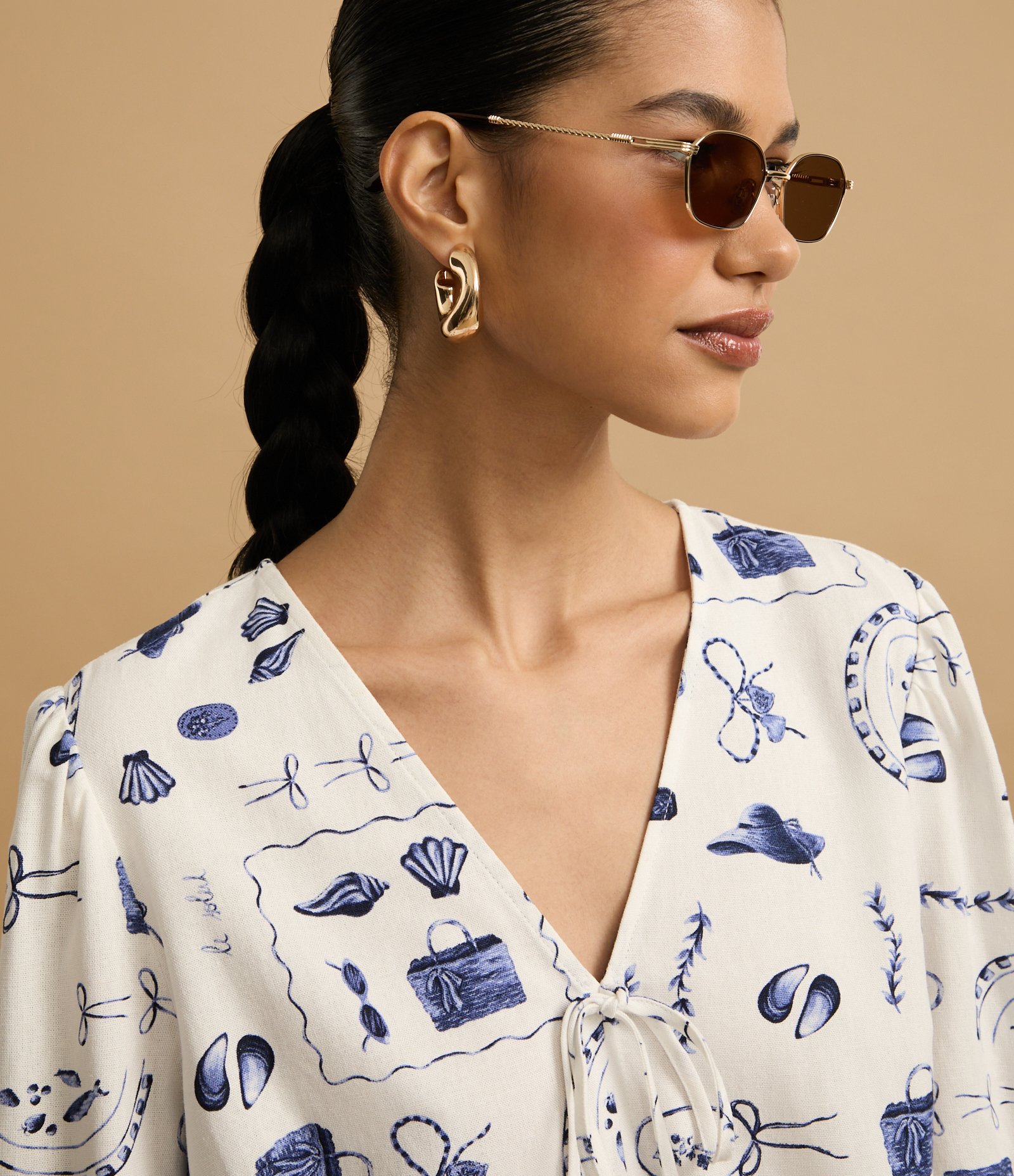 Blusa em Viscolinho com Manga Bufante e Estampa Praia Bicolor 4