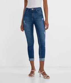 Calça Jeans Skinny Lisa com Barra Dobrada e Puídos