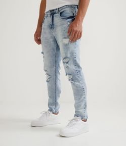 Calça  Skinny em Jeans Marmorizado com Rasgos e Cerzidos