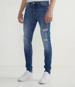 Calça Super Skinny em Jeans com Pequenos Puídos