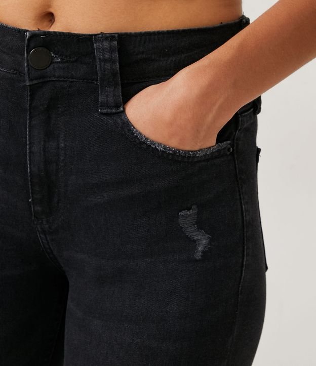 Calça Skinny Cintura Alta em Jeans com Puídos e Pontos de Luz Preto 4