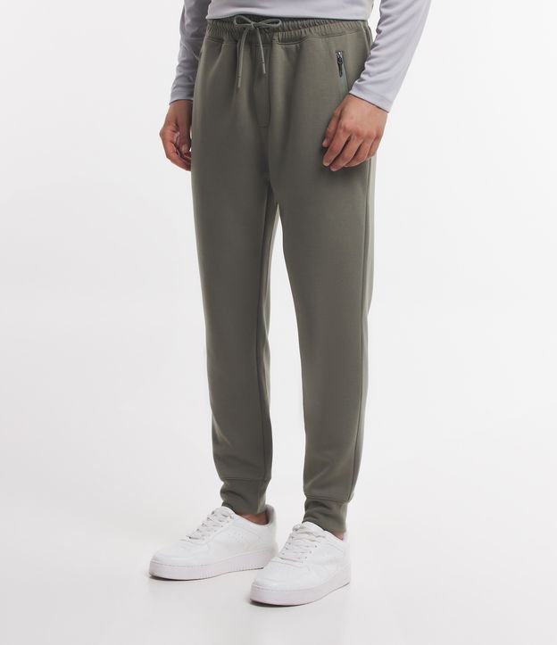 Calça nike com ziper best sale na barra