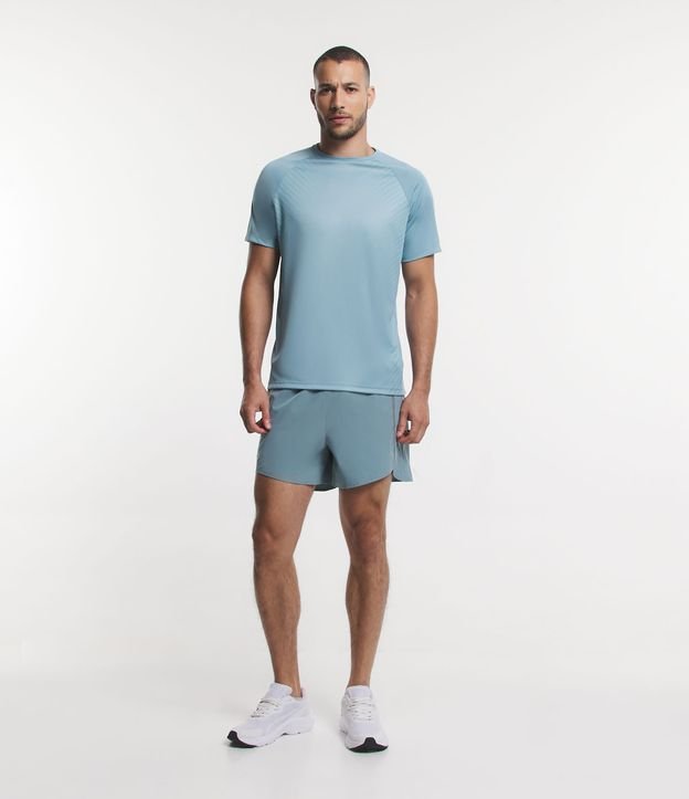Camiseta Esportiva em Dry Fit com Cava Raglan e Listras Laterais Azul Mineral 2