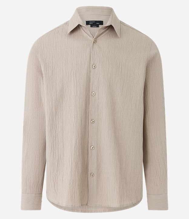 EGOX - $ 598 camisa manga larga $ 698 pantalón beige $ 1,300