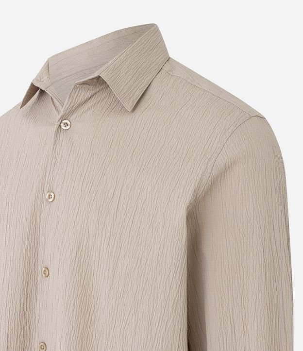 EGOX - $ 598 camisa manga larga $ 698 pantalón beige $ 1,300