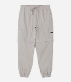 Calça Jogger Vira Bermuda com Bolsos de Zíper Recorte na Perna