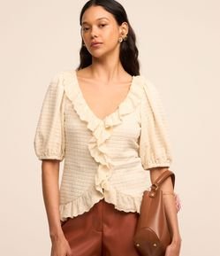 Blusa em Tecido Texturizado com Manga Bufante e Babados