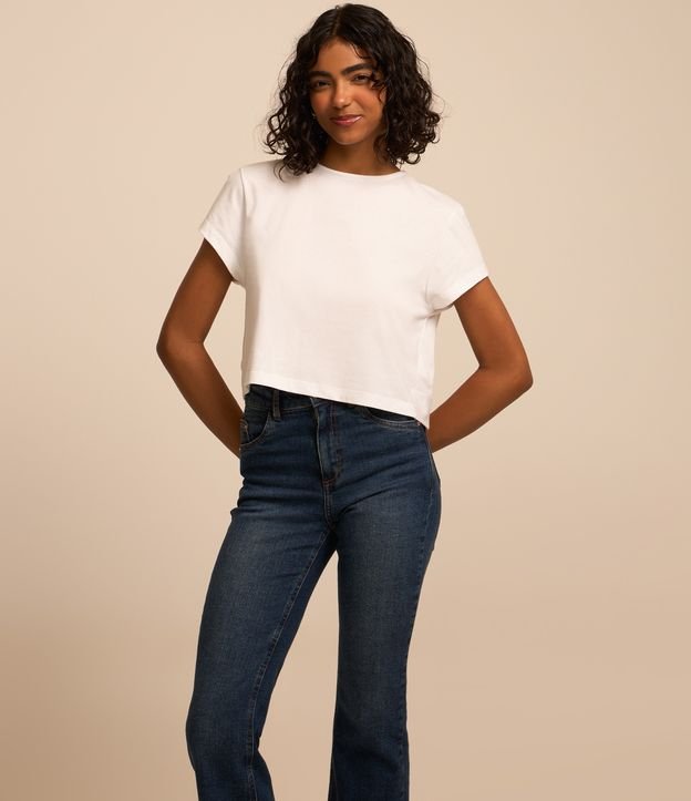 Calça Flare Jeans e Barra com Corte a Fio