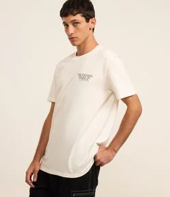 Camiseta Relaxed em Algodão Estampa Lettering e Cachorro Skatista