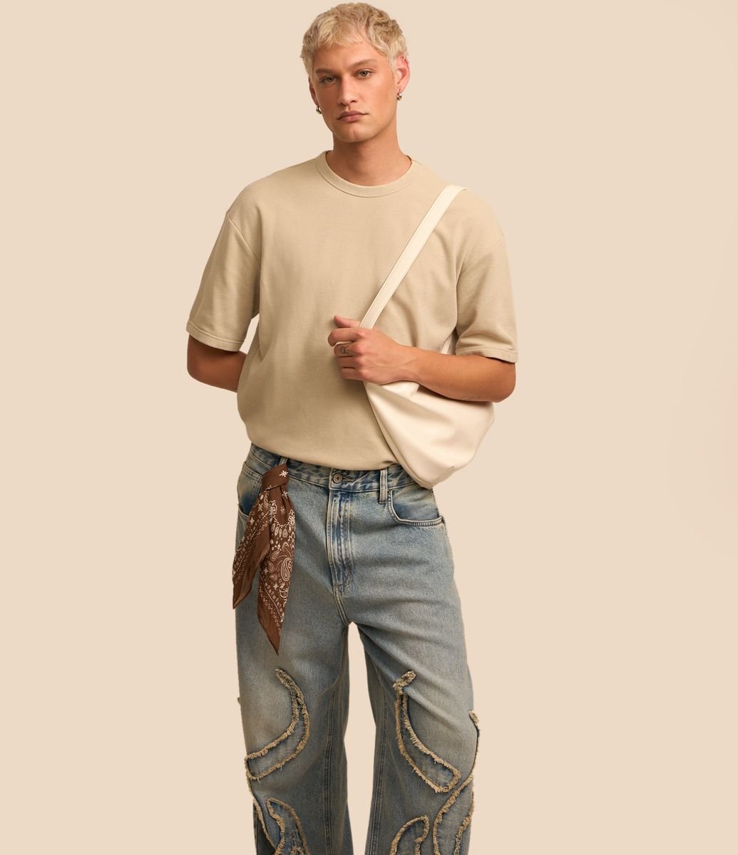Calça Baggy em Jeans com Bordado Tribal Jeans Médio