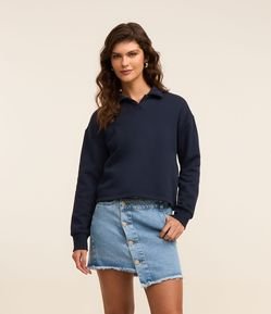 Mini Saia em Jeans com Abotoamento Deslocado e Barra Desfiada