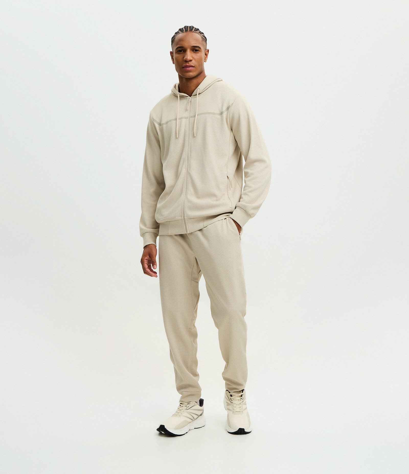 Calça Esportiva em Tecido Texturizado com Zíper nos Bolsos Bege 1