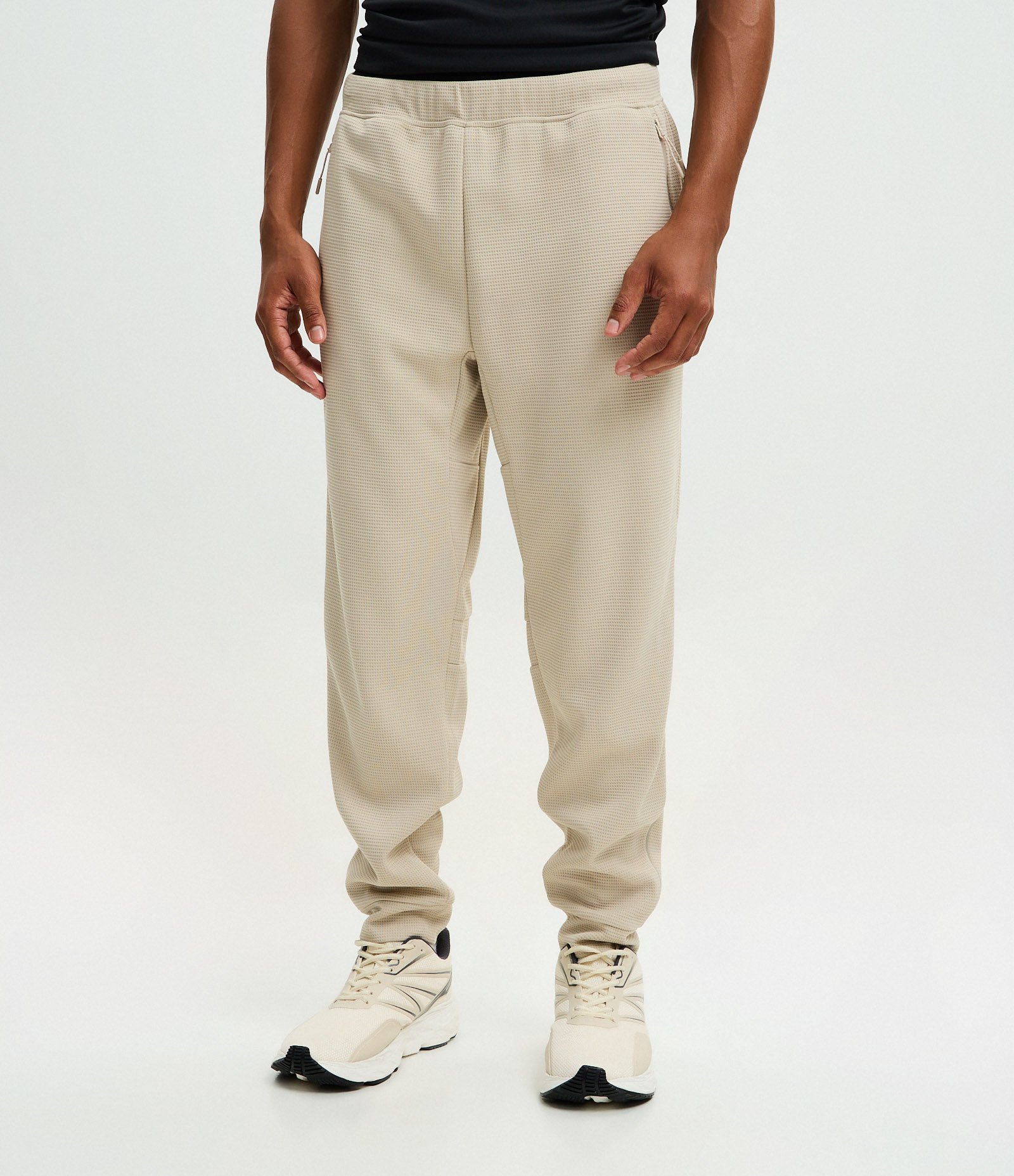 Calça Esportiva em Tecido Texturizado com Zíper nos Bolsos Bege 2