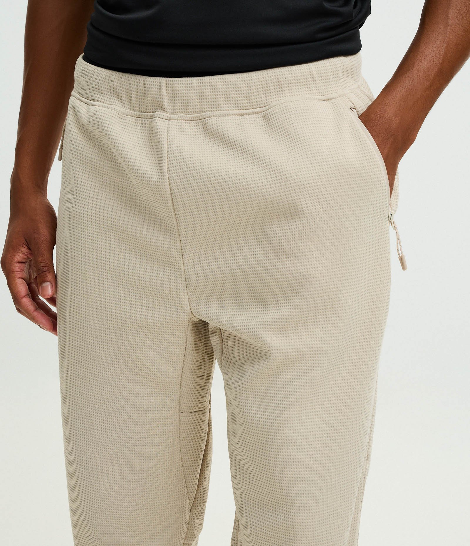 Calça Esportiva em Tecido Texturizado com Zíper nos Bolsos Bege 3