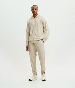 Calça Esportiva em Tecido Texturizado com Zíper nos Bolsos