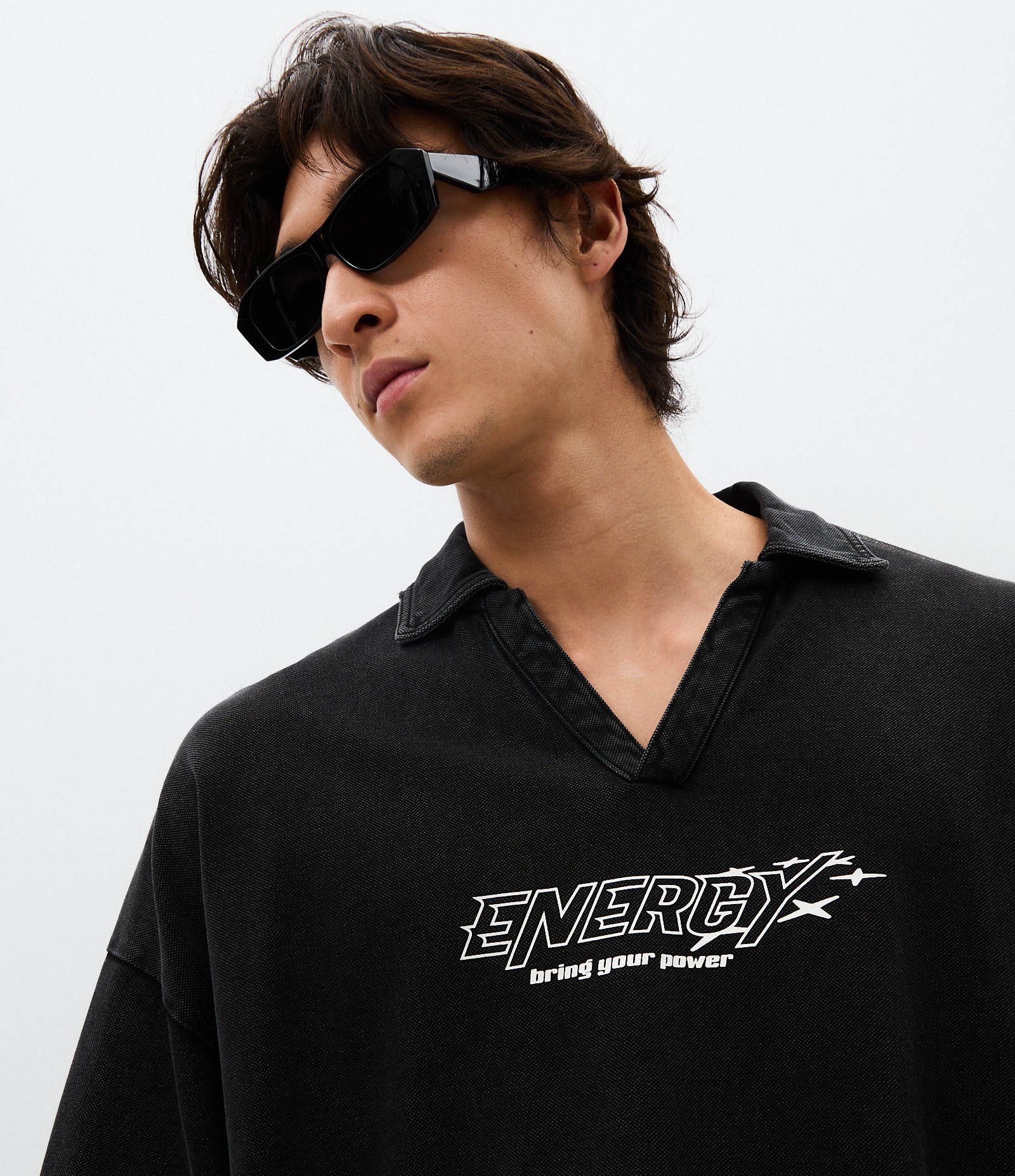 Camiseta Overboxy em Piquet com Gola Polo e Lettering Energy Preto