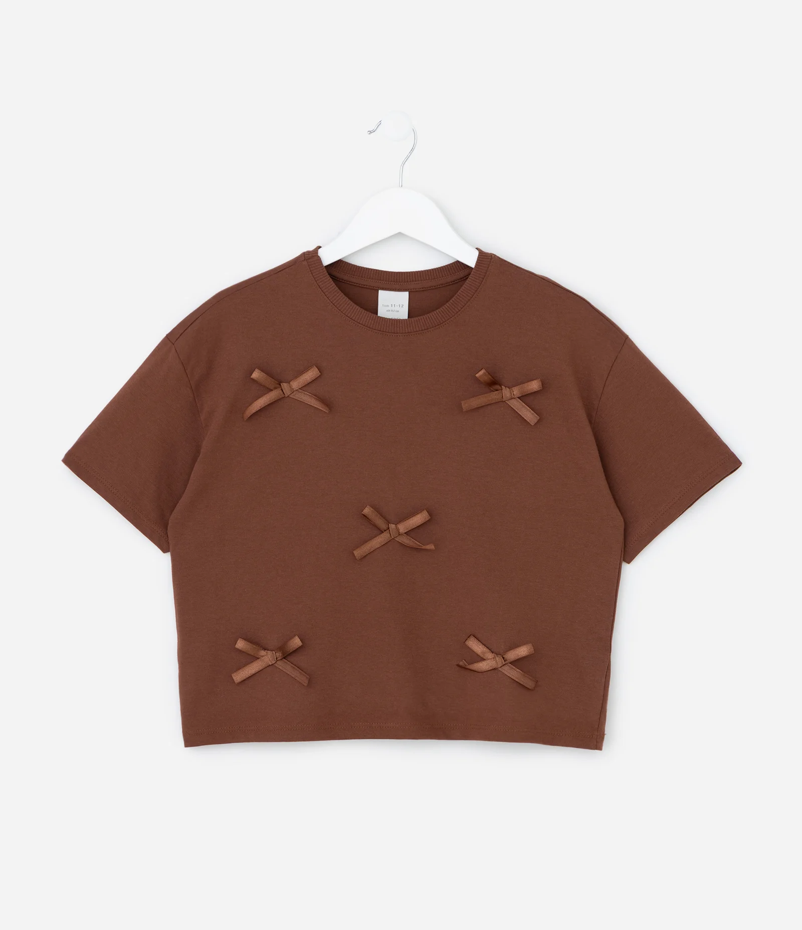 Camiseta Infantil Relaxed Boxy com Laços Aplicados – Tam 5 A 14 Anos Marrom 1