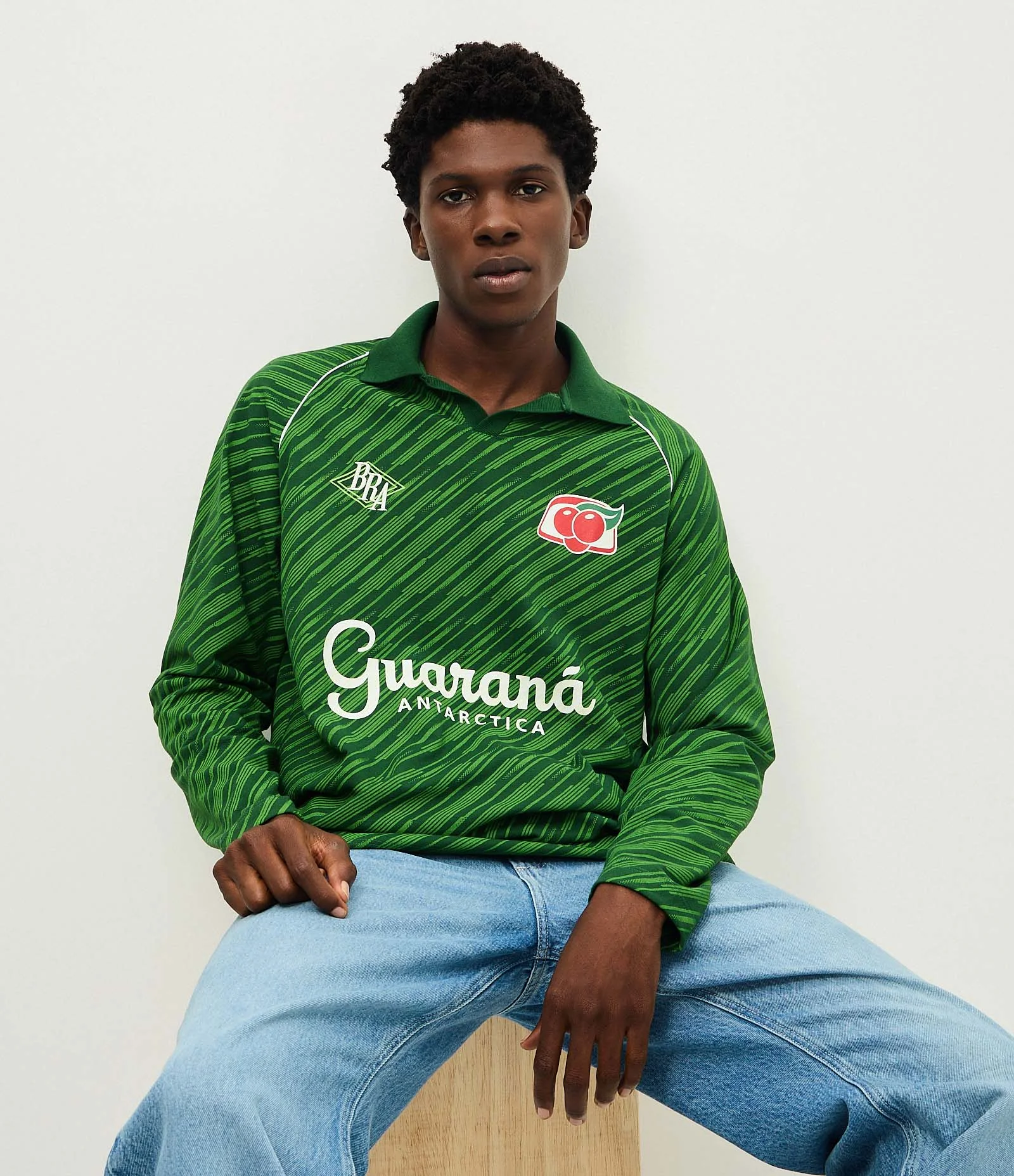 トップス goodness border l/s T-shirt (GREEN) Camiseta Oversized com Gola Polo e Estampa Guaraná Verde
